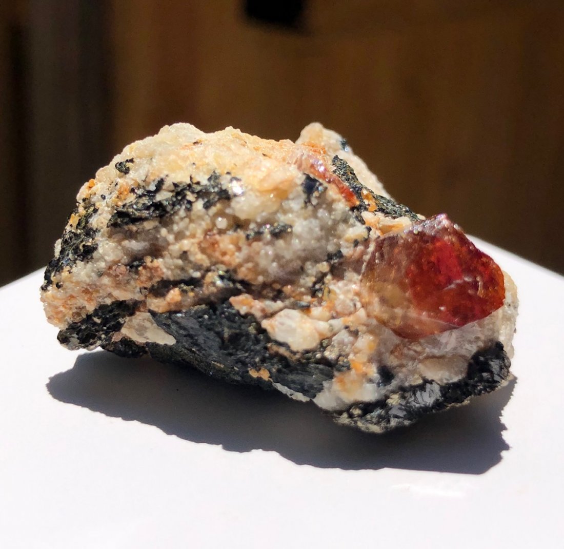 Zircon Specimen: Red zircon specimen. Gilgit District, Pakistan. 45mm X 35mm X 20mm. 39.3 Grams.
