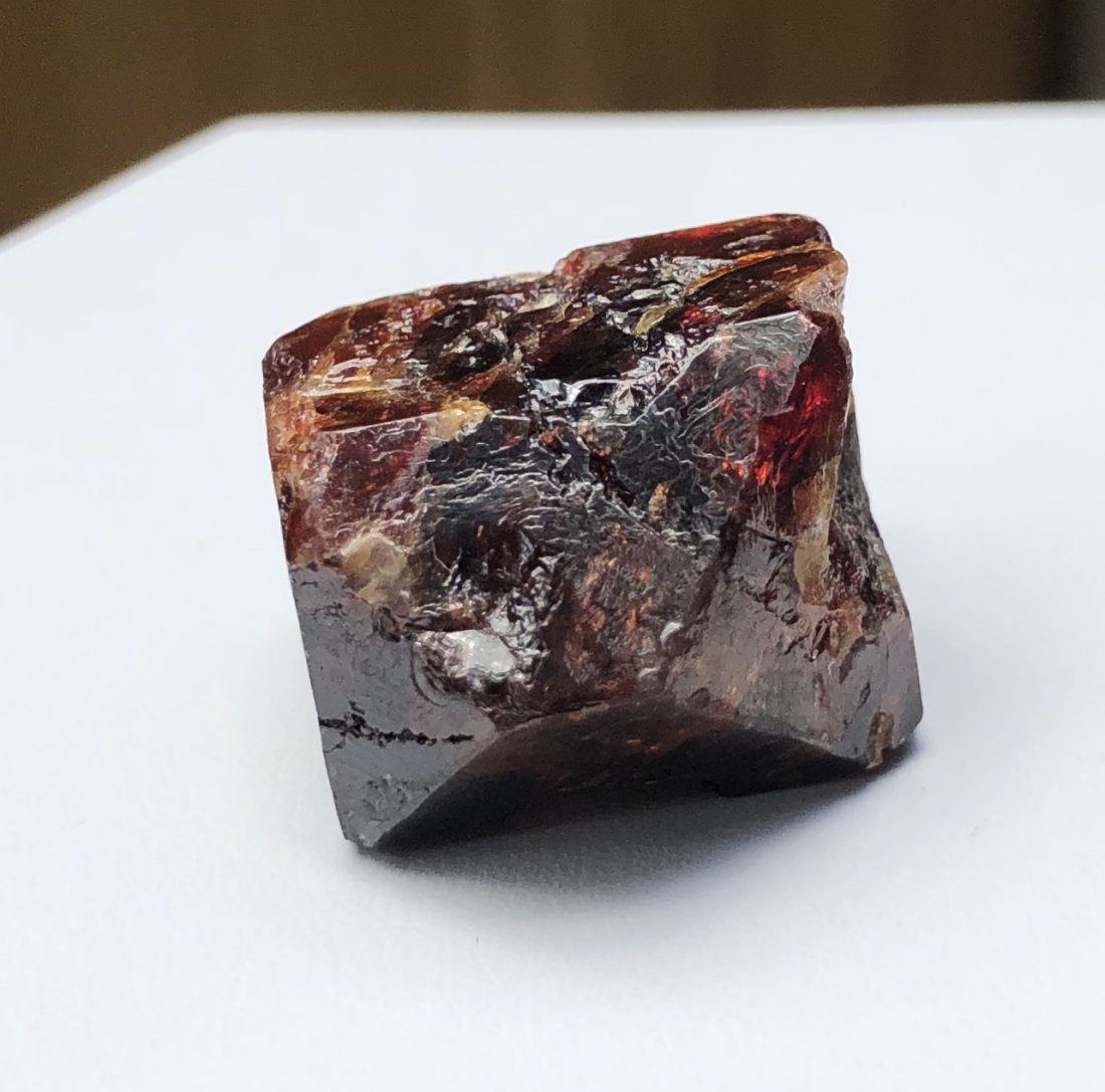 Red Zircon Specimen: Red zircon specimen. Gilgit District, Pakistan. 20mm X 22mm X 13mm. 16.4 Grams.