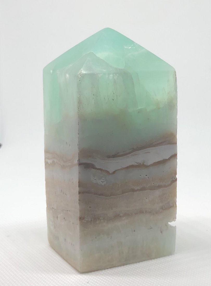 Blue "Caribbean" Calcite Tower: Beautiful blue "caribbean" calcite tower. Pakistan. Approx 4" x 1.75" x 1.75". Very solid tower. AS ALWAYS WE OFFER IN-HOUSE SHIPPING VIA USPS FLAT RATE SHIPPING, NO EXTRAVAGANT SHIPPING FEES!