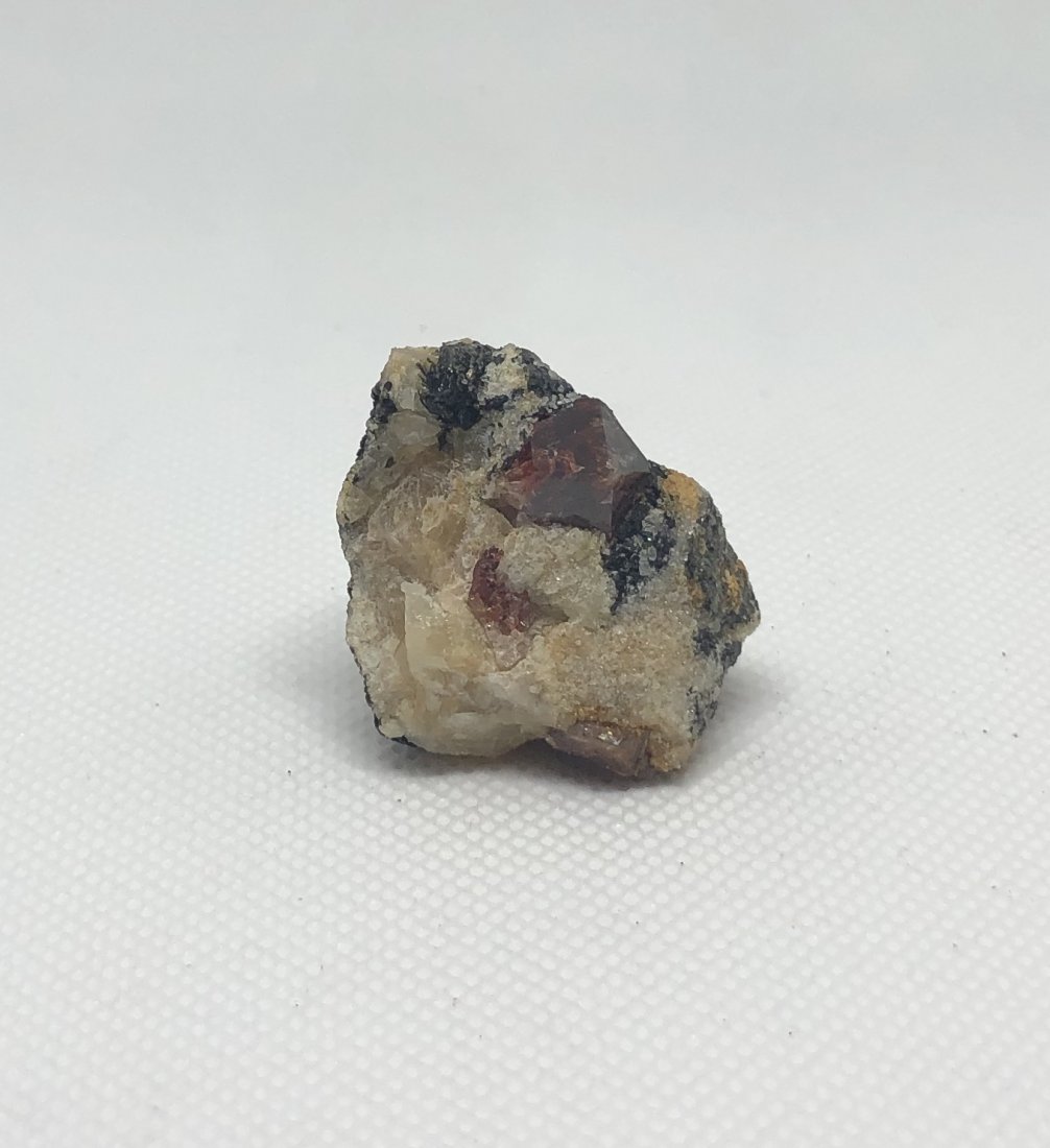 Red Zircon Specimen: Nice red zircon specimen. Gilgit, Pakistan. Approx 1.5" x 1" x 1". AS ALWAYS WE OFFER IN-HOUSE SHIPPING VIA USPS FLAT RATE SHIPPING, NO EXTRAVAGANT SHIPPING FEES!