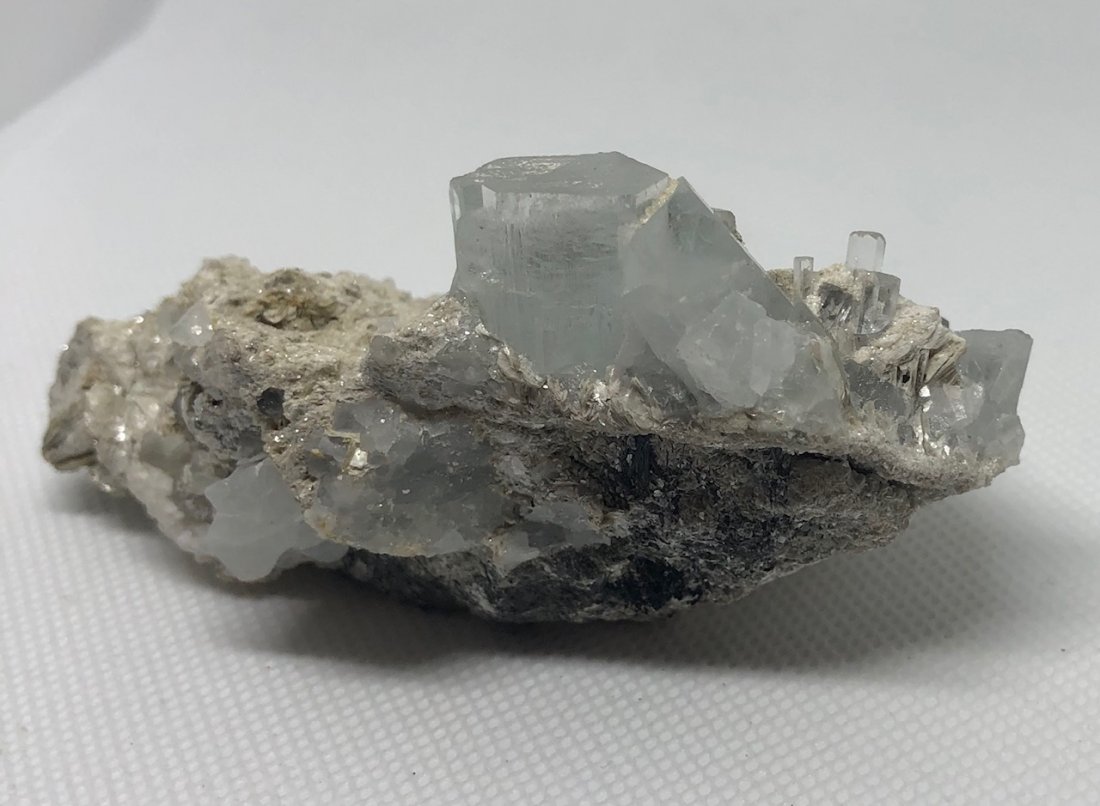 Aquamarine Specimen: Aquamarine specimen with many crystals on large matrix. Gilgit, Pakistan. Approx 4" x 2" x 1.75". AS ALWAYS WE OFFER IN-HOUSE SHIPPING VIA USPS FLAT RATE SHIPPING, NO EXTRAVAGANT SHIPPING FEES!