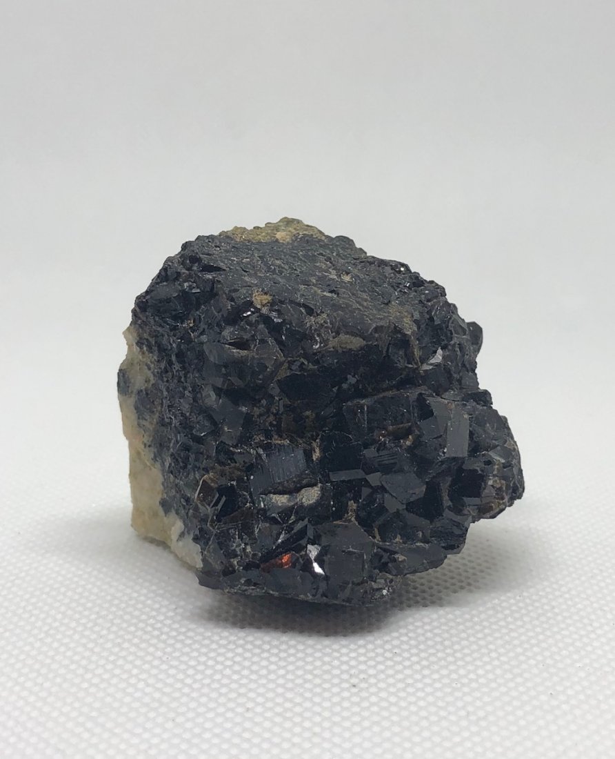 Garnet Specimen: Beautiful garnet specimen on quartz with tourmaline inclusions. Approx 2" x 2" x 1.75". Gilgit, Pakistan. AS ALWAYS WE OFFER IN-HOUSE SHIPPING VIA USPS FLAT RATE SHIPPING, NO EXTRAVAGANT SHIPPING FEES
