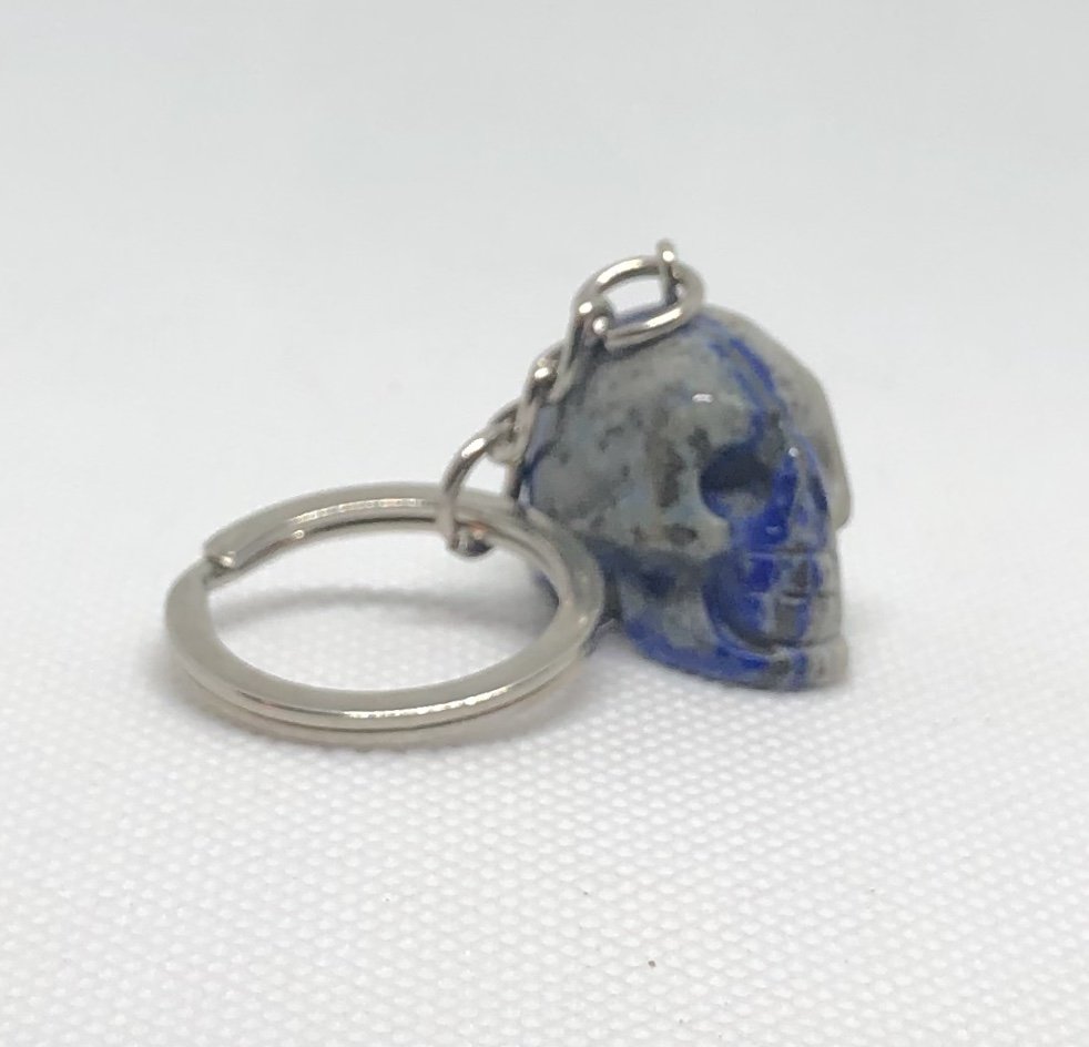 Lapis Lazuli Skull Keychain: Small 1" lapis lazuli skull keychain. AS ALWAYS WE OFFER IN-HOUSE SHIPPING VIA USPS FLAT RATE SHIPPING, NO EXTRAVAGANT SHIPPING FEES!