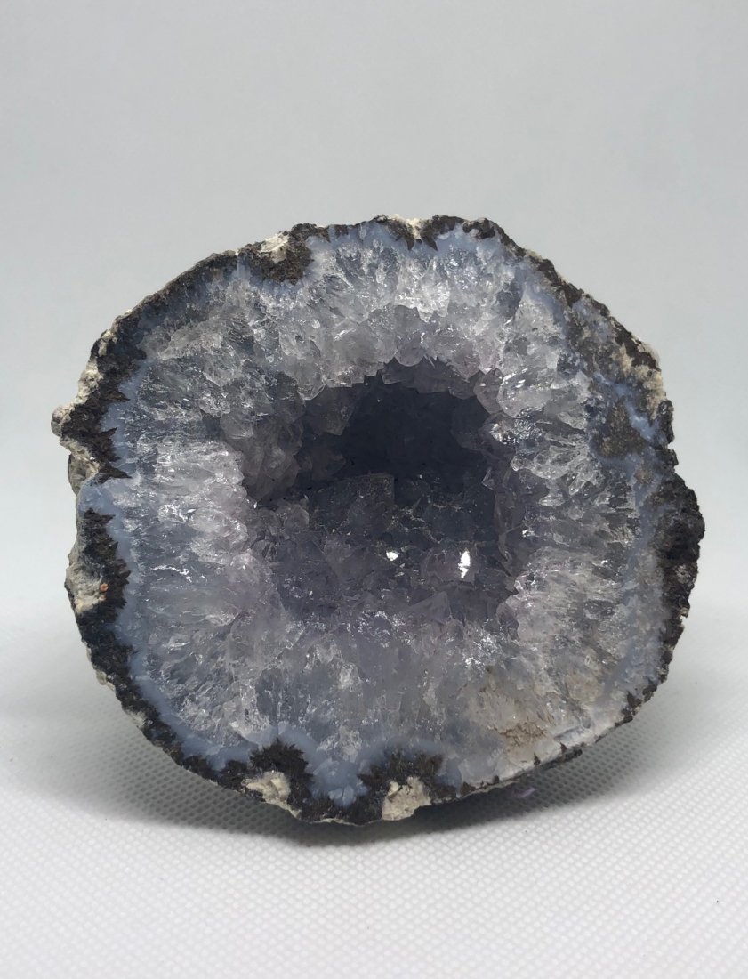 Geode Half: Beautiful geode half with blue agate rim and nice crystallization. Approx 3.5\" diameter. AS ALWAYS WE OFFER IN-HOUSE SHIPPING VIA USPS FLAT RATE SHIPPING, NO EXTRAVAGANT SHIPPING FEES!