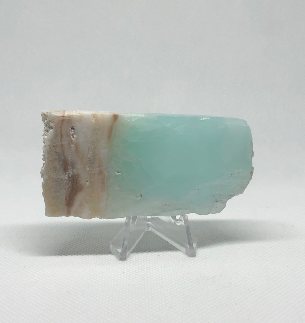 Blue "Caribbean" Calcite Slab: Slab of blue "caribbean" calcite. Approx 3" x 1.5". AS ALWAYS WE OFFER IN-HOUSE SHIPPING VIA USPS FLAT RATE SHIPPING, NO EXTRAVAGANT SHIPPING FEES!