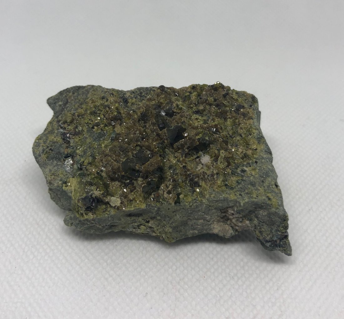 Green Andradite Garnets On Matrix: Green andradite garnets on matrix. Gilgit Pakistan. Approx 2.5" x 2" x 1". AS ALWAYS WE OFFER IN-HOUSE SHIPPING VIA USPS FLAT RATE SHIPPING, NO EXTRAVAGANT SHIPPING FEES!