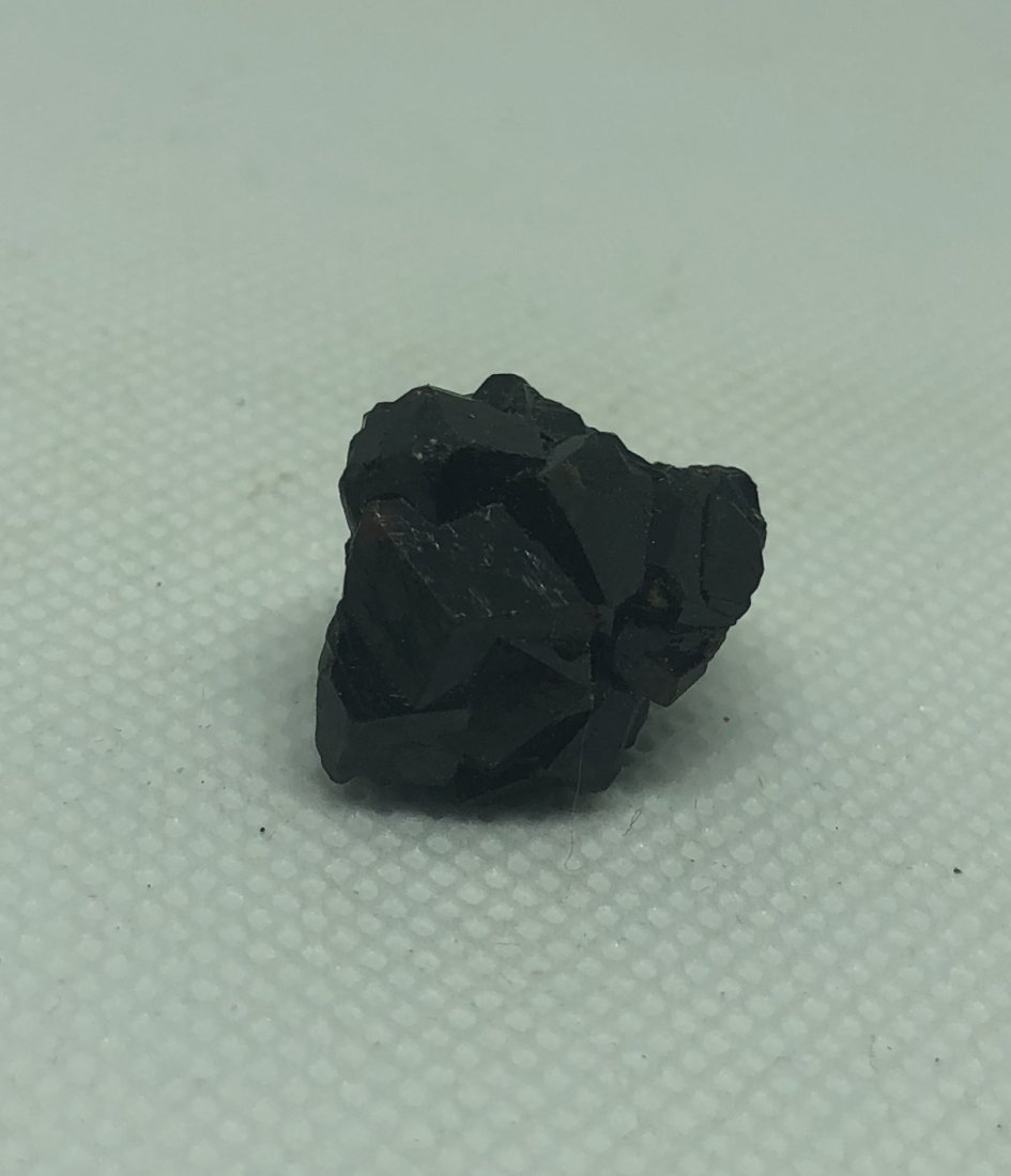 Small Garnet Specimen: Small garnet specimen. Gilgit, Pakistan. Approx .75". AS ALWAYS WE OFFER IN-HOUSE SHIPPING VIA USPS FLAT RATE SHIPPING, NO EXTRAVAGANT SHIPPING FEES!