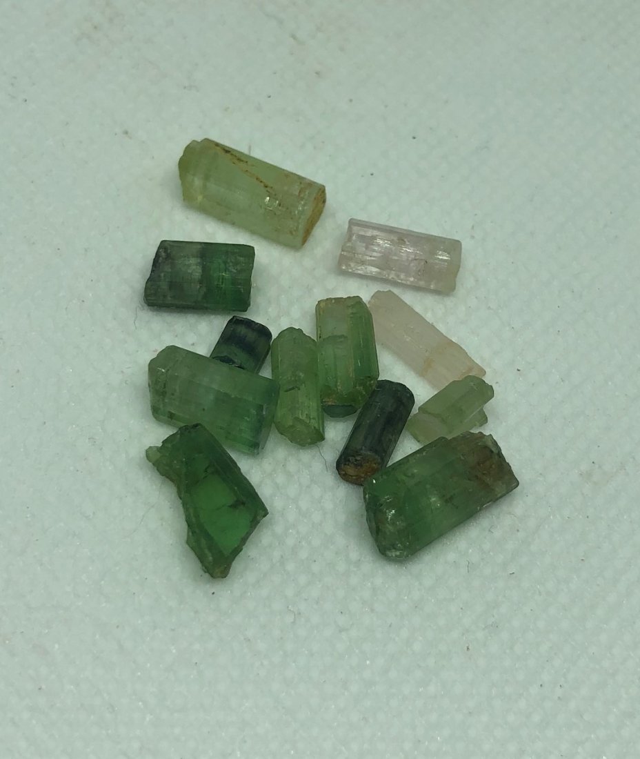 Tourmaline Lot: Small tourmaline lot. Approx 5 grams. Gilgit, Pakistan. AS ALWAYS WE OFFER IN-HOUSE SHIPPING VIA USPS FLAT RATE SHIPPING, NO EXTRAVAGANT SHIPPING FEES!