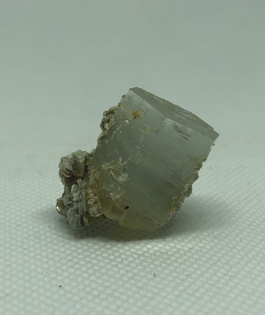 Aquamarine Specimen: Perfectly double terminated little chunky crystal with mica. Approx 1". Gilgit, Pakistan. AS ALWAYS WE OFFER IN-HOUSE SHIPPING VIA USPS FLAT RATE SHIPPING, NO EXTRAVAGANT SHIPPING FEES!