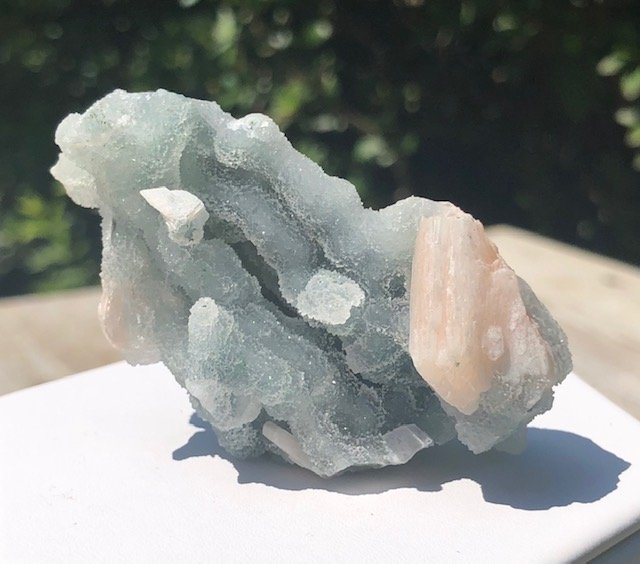 Stilbite On Chalcedony: Amazing peach stilbite on blue druzy chalcedony. This is a very rare and unique form. India. Approximately 2.75" x 1.5".