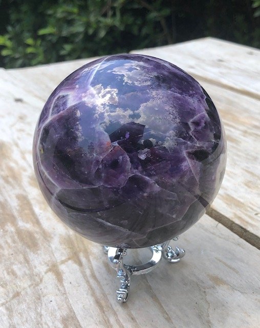 Dream Amethyst Sphere: Top quality chevron / dream amethyst sphere. Deep purple color and great quality overall. Highest quality dream amethyst sphere we have ever held, none of the typical brown inclusions and seams. Beaut