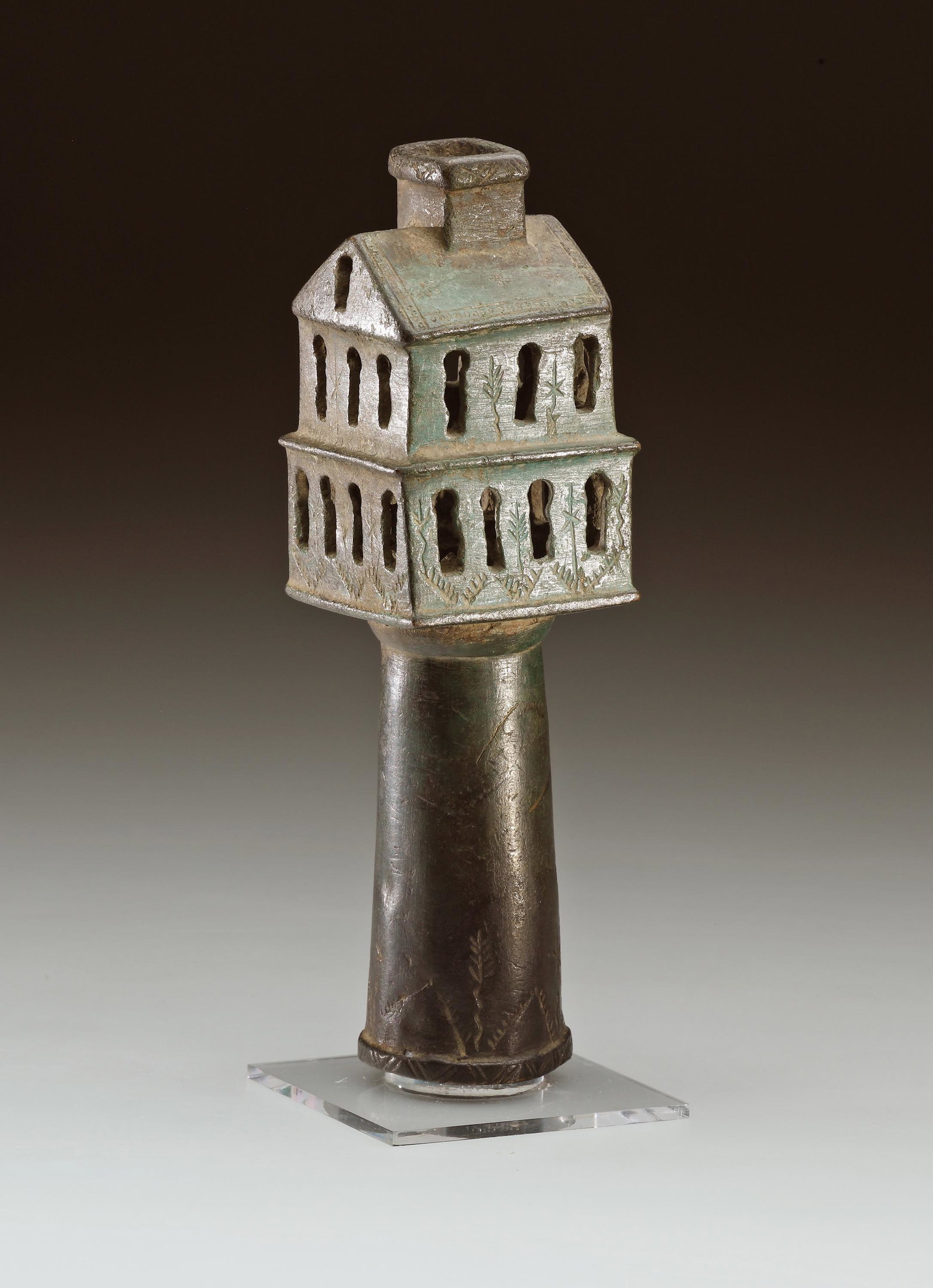 A Bronze Support for a Processional Cross: Byzantine 11th-12th cent. A.D.. Bronze. H. 17.6 cm. W. max. 5.2 cm Openwork base for a portable processional cross. Its shape is based on the church archictecture of the Middle Byzantine period. The t