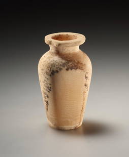 An Ointment Jar: Egyptian 3rd - 1st mill. B.C..Alabaster. H. 6.9 cmWith short, broad neck and pronounced rim. Minor chipping to the rim. Some brownish deposits.Formerly priv. coll. M.C. (b. 1933) and R. C-B. (b.