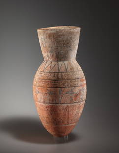 An Ovoid Vessel with Lotus and Hieroglyphs: Egypt, New Kingdom, probably 18th Dynasty ca. 1550-1292 B.C..Clay. H. 36.3 cmElongated vessel with an ovoid body and a high, slightly flared collar neck. The entire vessel is divided into registers