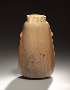 Alabastron: Egyptian, Late Period 6th - 4th cent. B.C..Alabaster. H. 16 cmCompact vessel with soft, gently sloping contours on a flat base. Two small knobbed handles on the shoulder. The veining of the finely