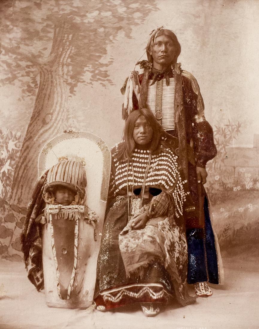 A UTE FAMILY 1898 WILLIAM HENRY JACKSON & SMITH: JACKSON-SMITH A Ute Family, 1898, 8.7x7" Collodion Silver Print with Hand coloring, attached to gray 12x11" over mat. Title credit in negative. ASG# WHJS/1005 When William Henry Jackson joined the Det