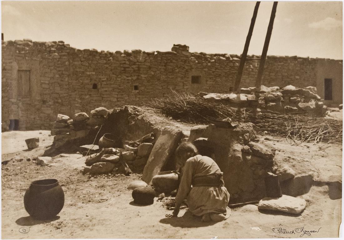 FREDERICK MONSEN Nampeyo, the artist-potter of the Hopi: FREDERICK MONSEN Nampeo [Nampeyo], the artist-potter of the Hopi people, arranging pottery for firing, Hano, First Mesa, Arizona, ca. 1900s, 13.5x19.5" Gelatin Silver Print. Signed in image lower righ