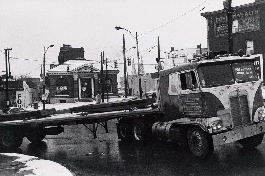 LEE FRIEDLANDER Pittsburg 1980: LEE FRIEDLANDER 354-7: Pittsburgh (McKee's Rocks), 1980,7.6x11.2" Silver Gelatin Print on 11x14" paper. Signed, titled and dated verso with 1980 copyright stamp. ASG# LF/1299 Signs, a turning truck, m