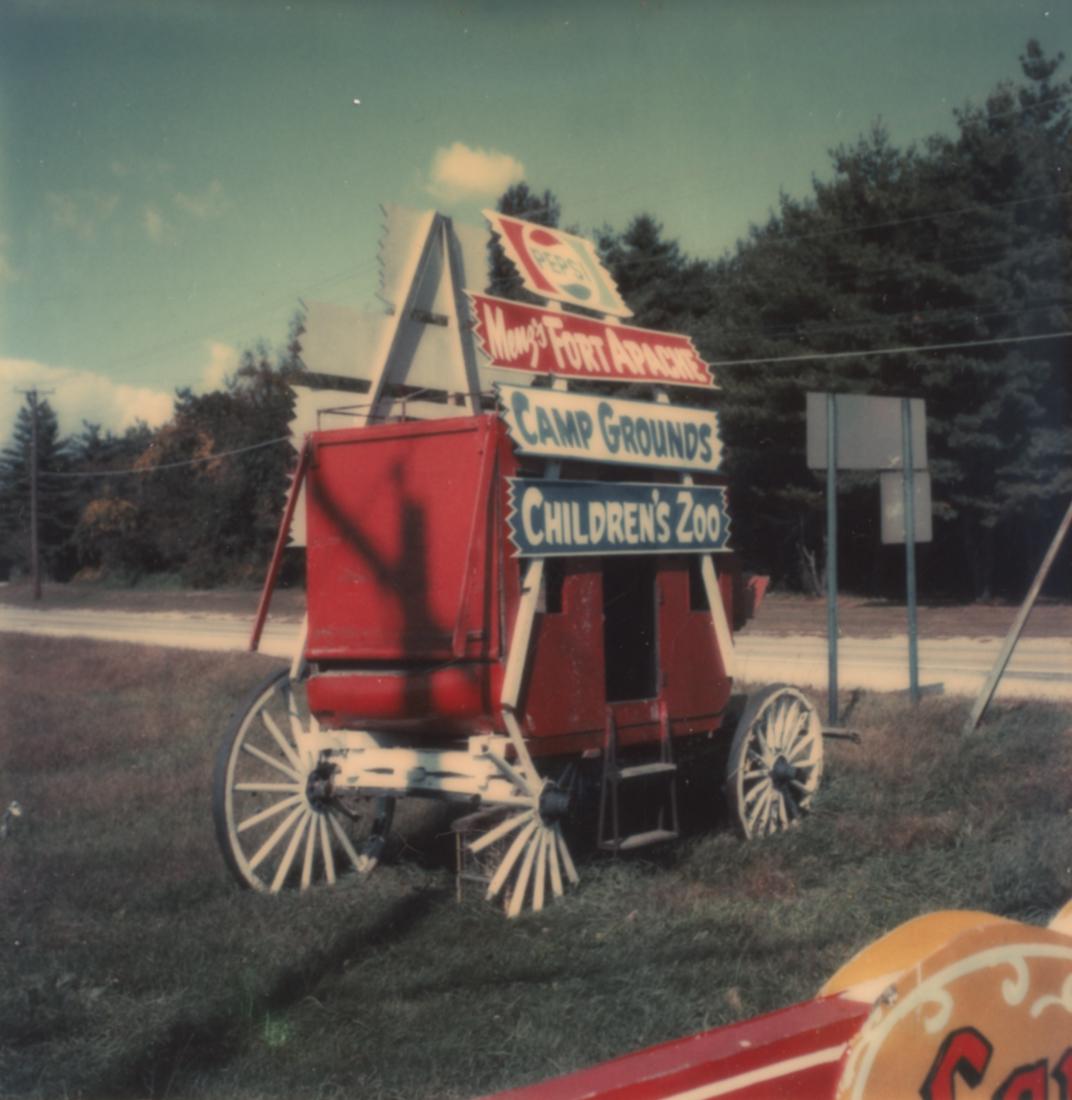 2 WALKER EVANS Polaroids Signs 1973-4: 1. WALKER EVANS [ Advertisement For Roadside Attraction: "Menz's Fort Apache" ], 3/4 View, October 17, 1973, 3x3" Polaroid SX-70 Print. ASG# WE/1113 2. WALKER EVANS [ Billboard for "Pestfree" Extermin