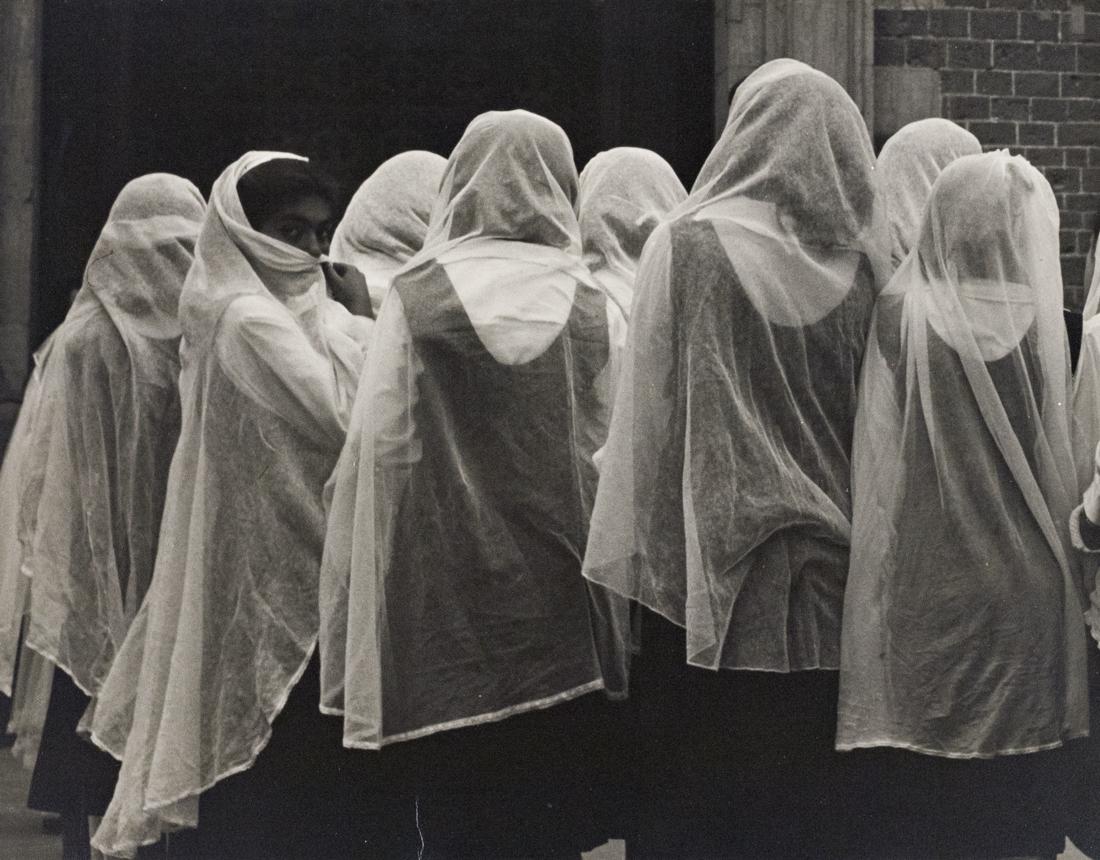 JOHN GUTMANN Confirmants, Mexico 1960: JOHN GUTMANN The Confirmants, Young Girls Waiting for Confirmation, Church of Guadalupe, Mexico City, 1950 10.3x13.5" Gelatin Silver Print on 11.2x13.9" white board. Signed in pencil on mount below pr