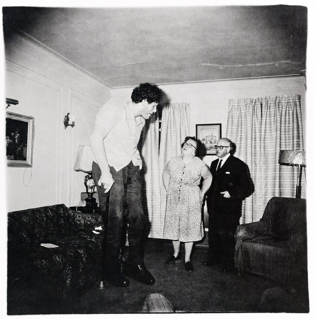 DIANE ARBUS Jewish Giant 1970: DIANE ARBUS, Jewish Giant at Home with his Parents in the Bronx, 1970, 10x9.8", photogravure, printed 1979, edition of 1000. Printed label affixed to print verso: Diane Arbus / A portfolio of 12 print