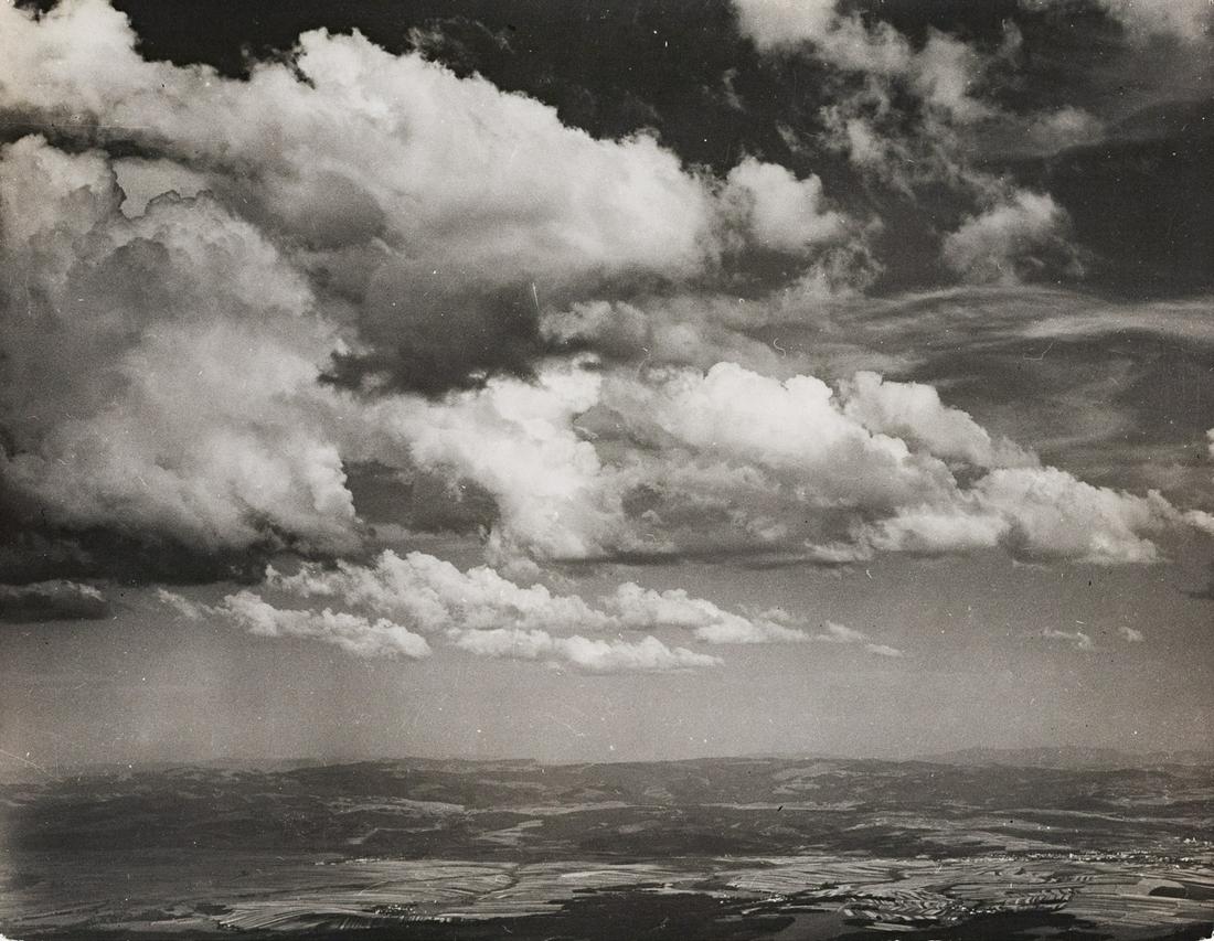 MARGARET BOURKE-WHITE Beautiful Cloudscape 1937: MARGARET BOURKE-WHITE, Clouds, artist's stamp verso, c. 1937, 7.5x9.5", gelatin silver print, printed c. 1939. Stamped in red ink on print verso: Photo by Margaret Bourke-White; inscribed in pencil: P