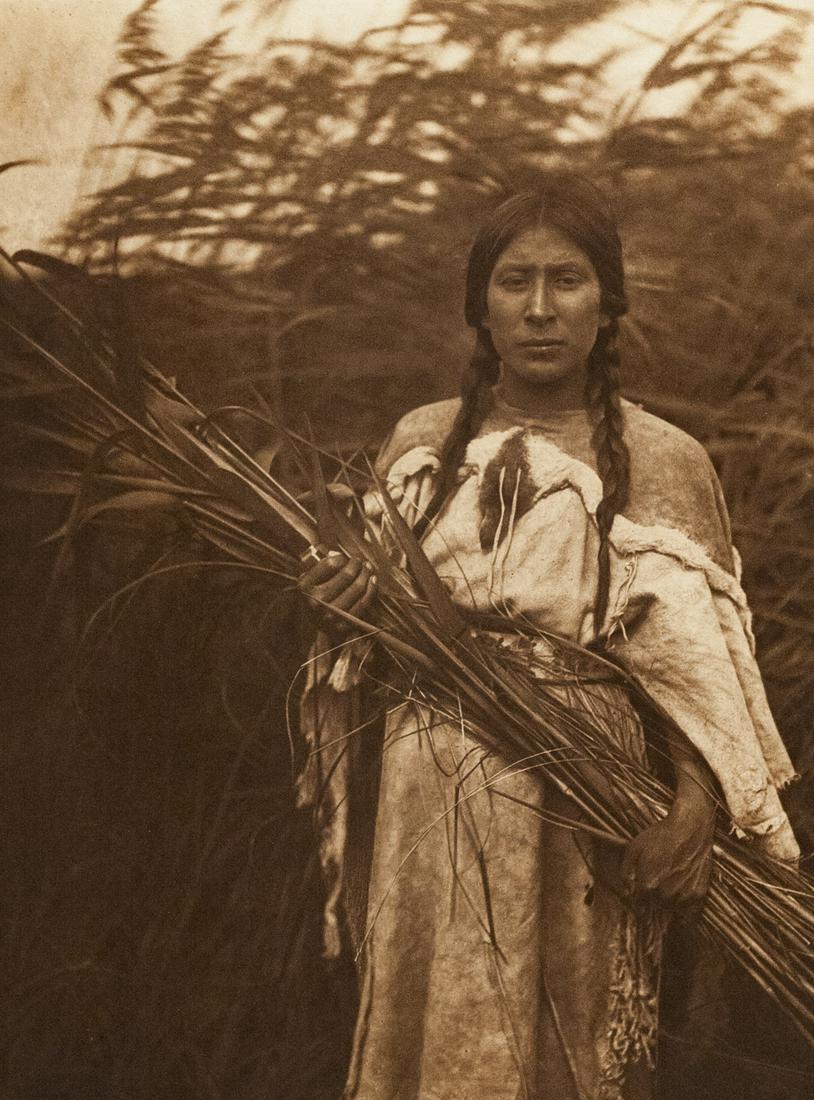 EDWARD CURTIS Arikara Woman Classic Pose: EDWARD CURTIS, Plate 160 The Rush Gatherer - Arikara, 1908, 15.7x11.8" photogravure from Portfolio V of The North American Indian (Arikara, Mandan, Atsina Plains) printed c. 1984 by Classic Editions, 