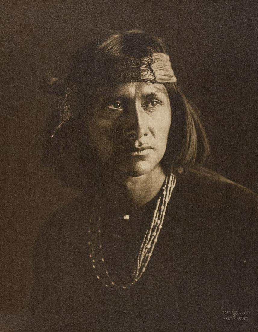CARL MOON The Wolf Navaho 1905: CARL MOON, The Wolf. Navaho, 1905, 9.6x7.6" gelatin silver print, titled 'The Wolf' on brown paper mount. Copyright 1907 by Fred Harvey embossment stamp in image lower right. This print is FRAMED One