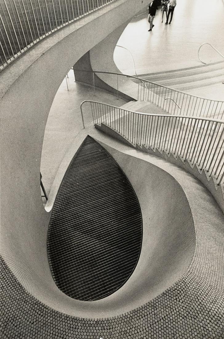 BEDRICH GRUNZWEIG Czech Modernist View 1964: F. BEDRICH GRUNZWEIG. TWA, Kennedy Airport, NY, c. 1964. 9.4x6.4" gelatin silver print. Printed c. 1964. Photographer's stamp on print verso in purple ink; Photo Researchers, Inc. NYC / 8H1758 label;