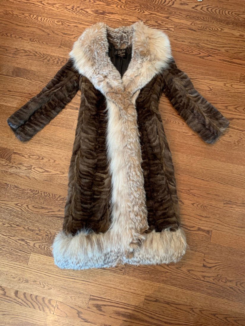 Fur Coat: This beautiful mink fur coat was once worn by Ruth Henderson. Her husband Skitch Henderson was the first band leader on the Johnny Carson show and the found of the New York Pops. It measures 4' long a