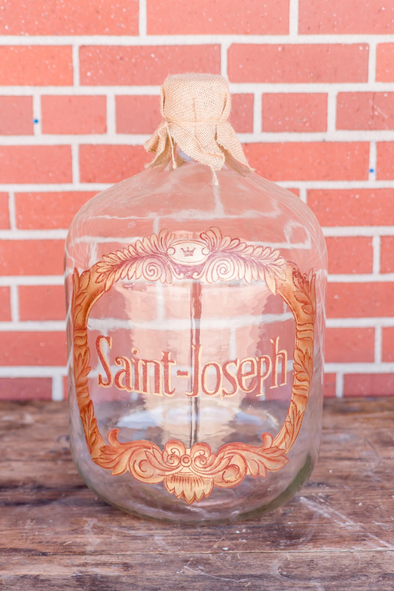 Vintage Wine Bottle: Vintage wine bottle with hand tied burlap top