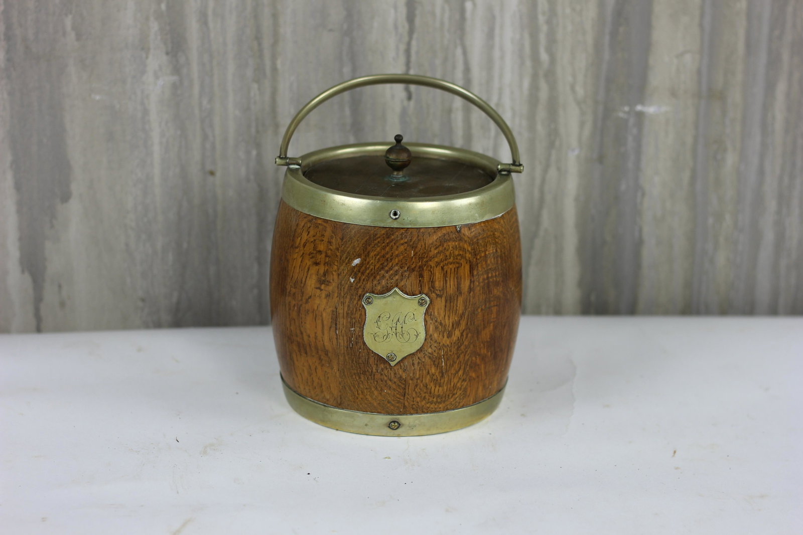English Biscuit Barrel: English oak biscuit barrel with porcelain liner.