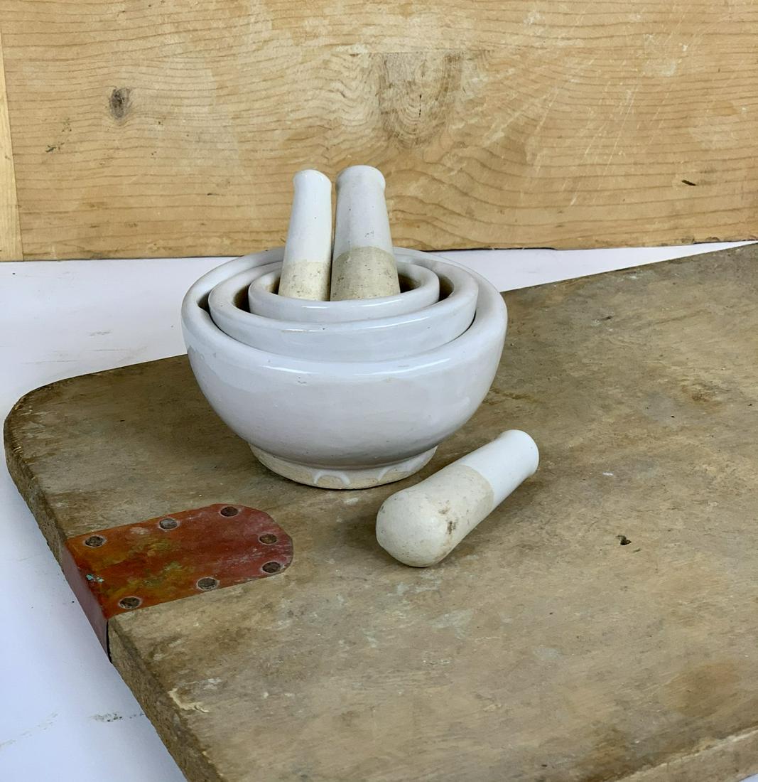 Set of Three Mortar and Pestle: Lot of three porcelain mortars with vintage style pestle. Great kitchen dÃ©cor! 2.75'' Dia x 1.5''H3.75'' dia x 1.75''H4.5''x4.5'' x 2.25''H