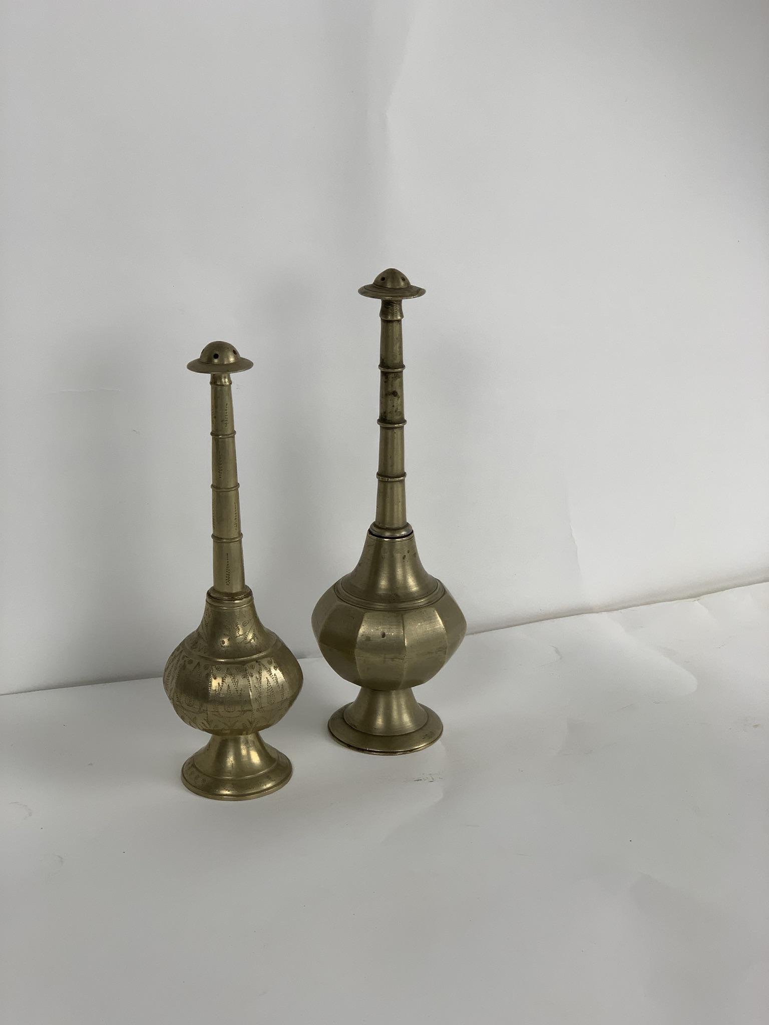 Lot of 2 Brass Rose Water Bottles: Lot of two brass rose water bottles make for a great decorative accent piece on a shelf, console, or mantle.