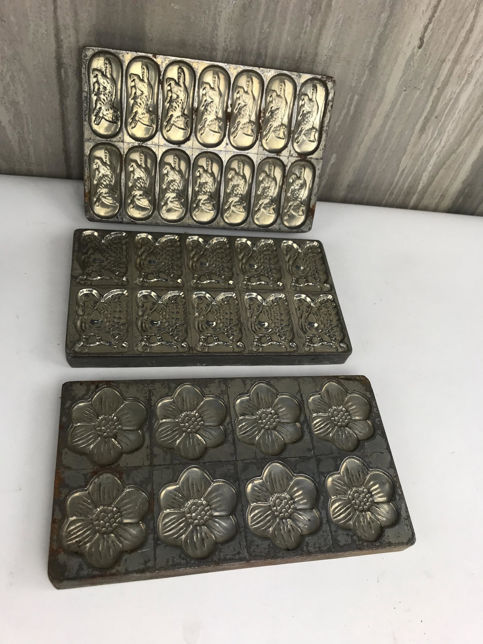 Lot of Three Vintage Chocolate Molds: Great grouping of three vintage metal chocolate molds from a Belgium chocolate factory