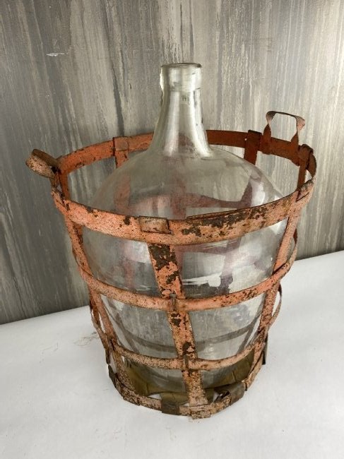 Large European Wine Bottle In Metal Crate: Beautiful crated European wine bottle. Amazing piece of décor in the corner of a room or a great gift for your favorite wine enthusiast!