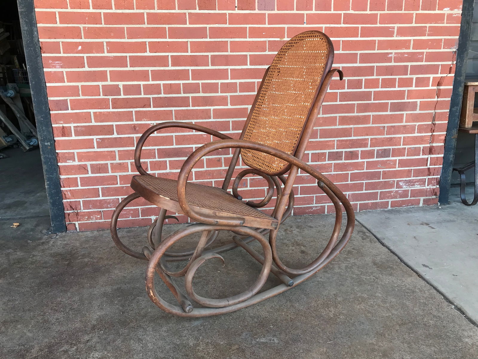 Vintage Thoret Style Boho Bentwood and Cane Rocking Chair: Vintage Cane seat Rocking Chair with Bentwood frame. In the style of Michael Thonet Handcrafted Furniture who was renowned for their graceful curves and classic appeal.