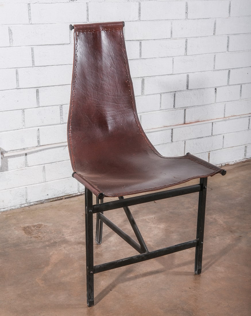 Tripod Leather "T" chair by Katavolos, Kelley and Littell for Laverne: Modern style Katavolos, Kelley and Littell for Laverne International Dining "T" Chair with black steel frame and dark leather seat and back, circa 1952. Leather has a rough edge with leather stitch de