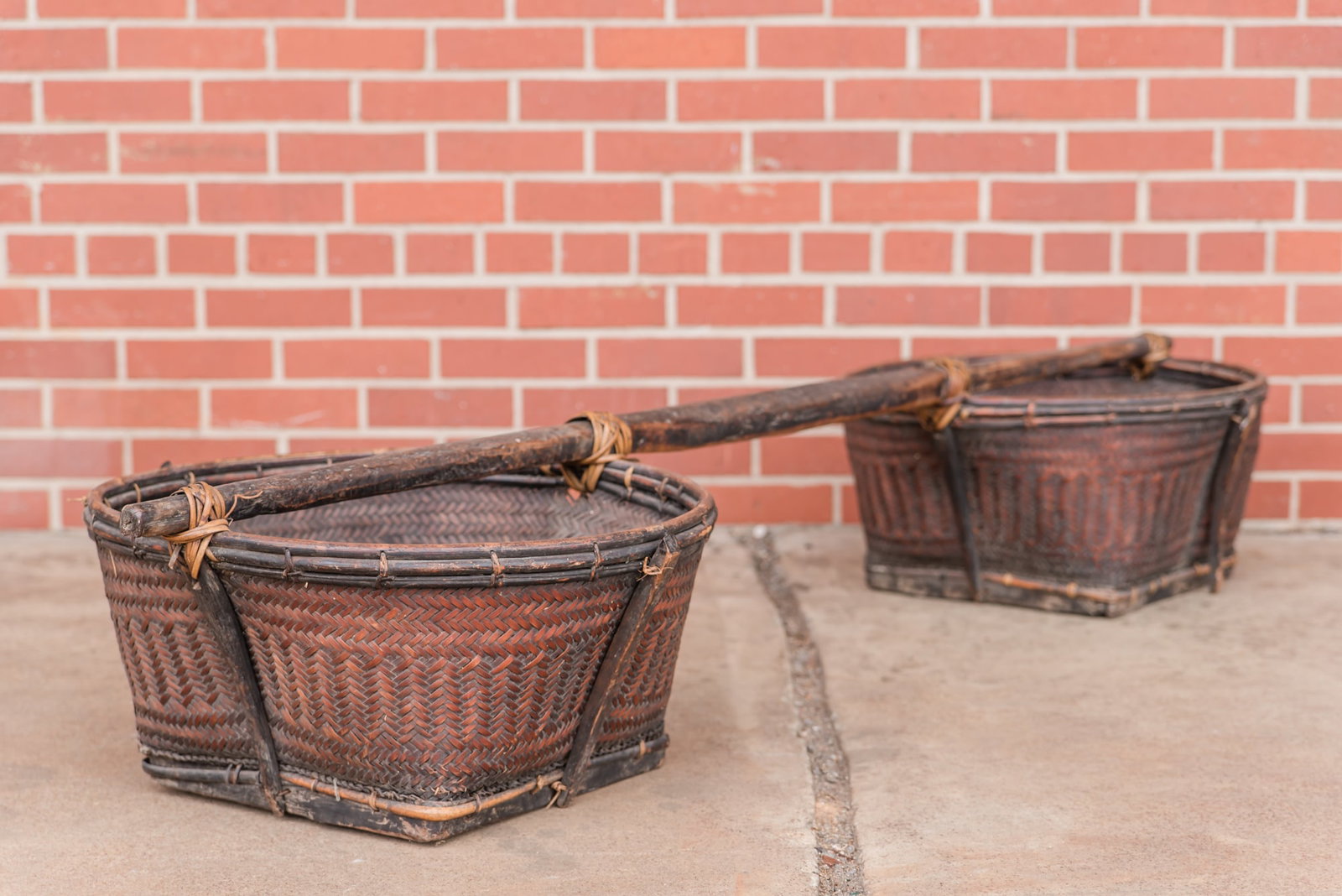 20th Century Shoulder Rice Carrying Yoke: A very nice example of a vintage of a early 20th century shoulder rice carrying yoke with bamboo & rattan baskets