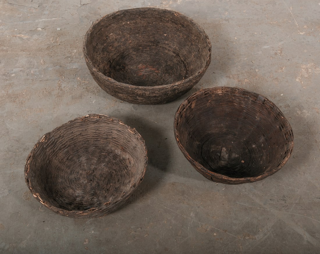 Lot of Three Indian Tribal Baskets: A lot of three vintage woven baskets from a village in India that were use for food storage. 5"x15"5"x12"4"x12"