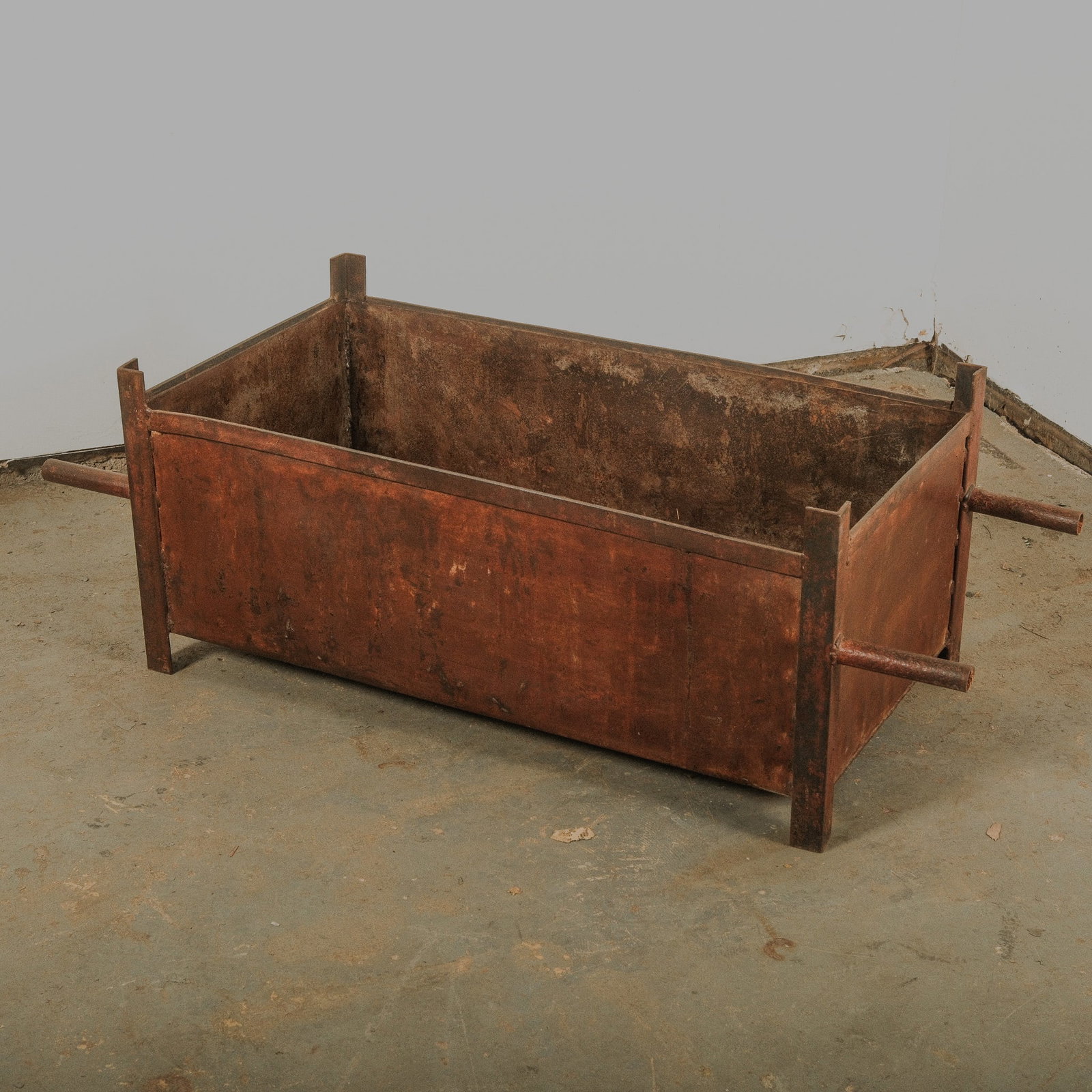 Rectangular Metal Industrial Crate with handles: Rectangular metal industrial cart with exterior support handles.