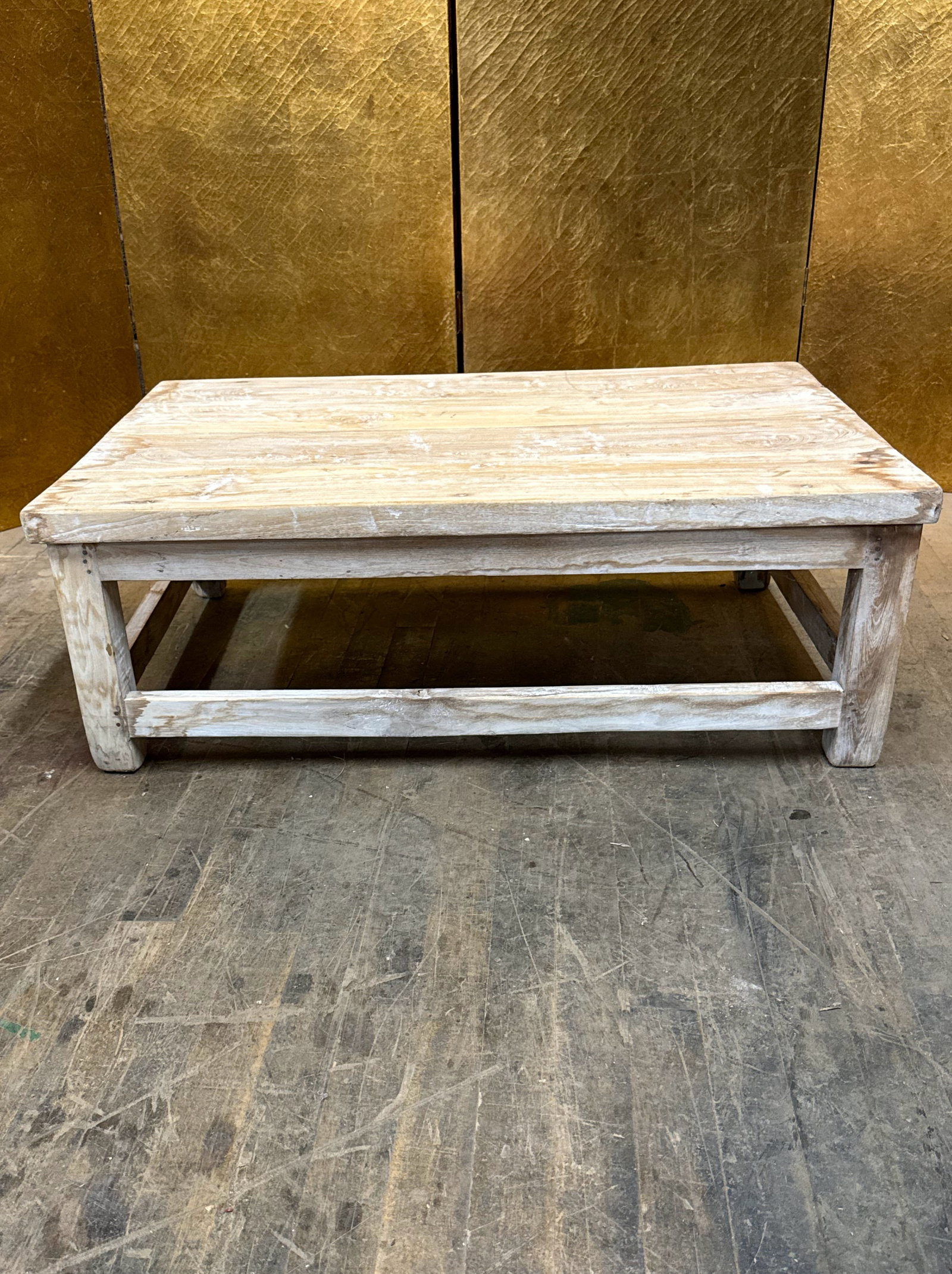 Rustic White Wash Wooden Riser: Rustic whitewashed wooden riser featuring a rectangular top and sturdy open base with stretcher supports. The distressed whitewash finish highlights the natural wood grain and rustic character. A