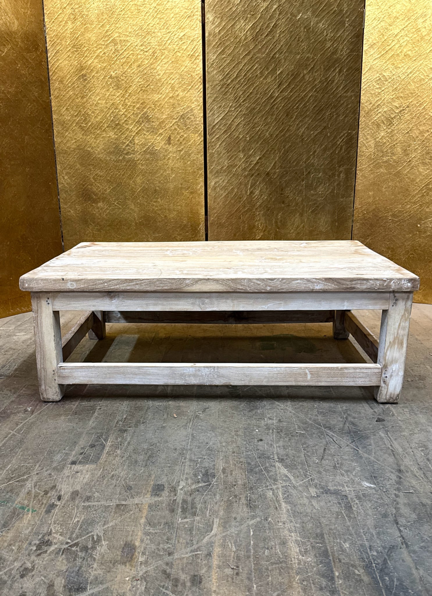 Rustic White Wash Wooden Riser: Rustic whitewashed wooden riser featuring a rectangular top and sturdy open base with stretcher supports. The distressed whitewash finish highlights the natural wood grain and rustic character. A