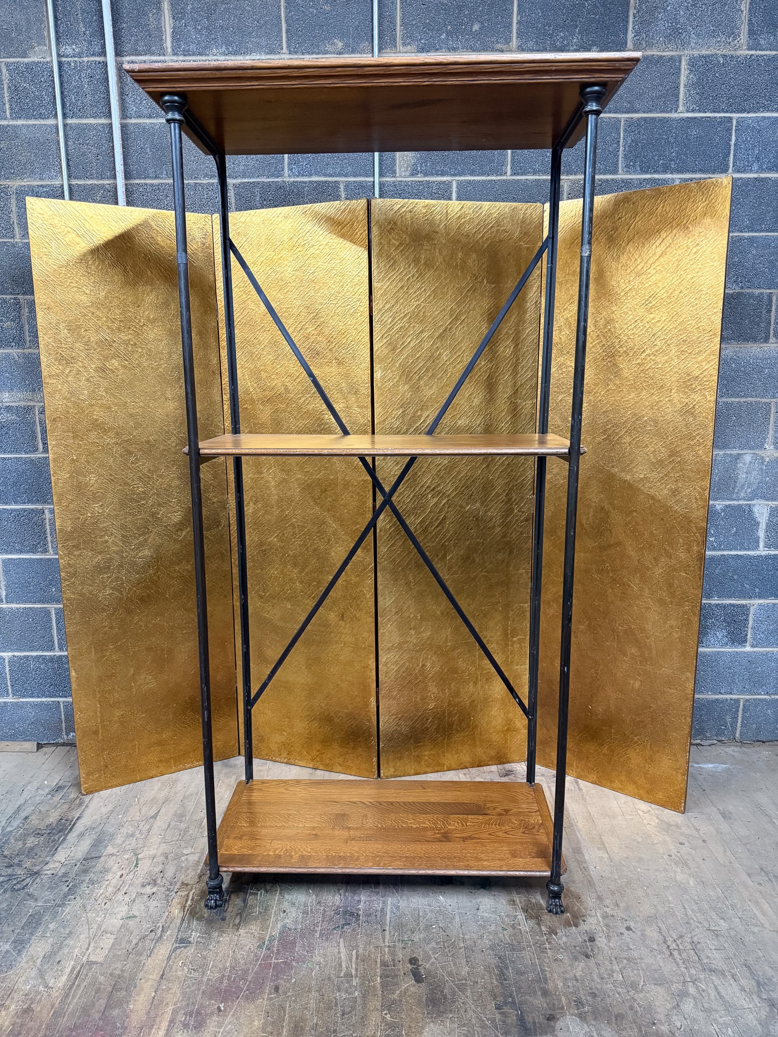 French Cast Iron and Oak Petit Parisien Industrial Shelving Unit: French industrial shelving unit constructed with a cast iron frame and solid oak shelves. The tall open structure features slender iron uprights, decorative cast elements, and cross-braced back suppor