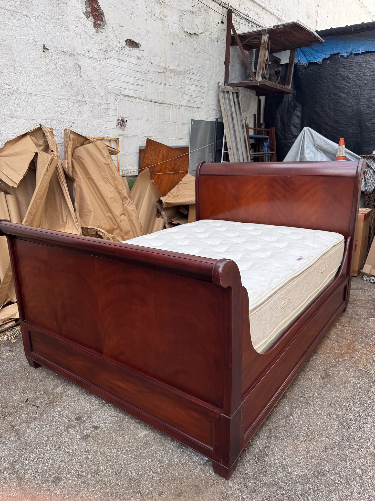 Ralph Lauren Sleigh Bed: Classic full-size sleigh bed by Ralph Lauren Polo line, crafted in a richly stained wood with beautifully curved headboard and footboard. The design reflects Ralph Laurens signature aesthetic timeless