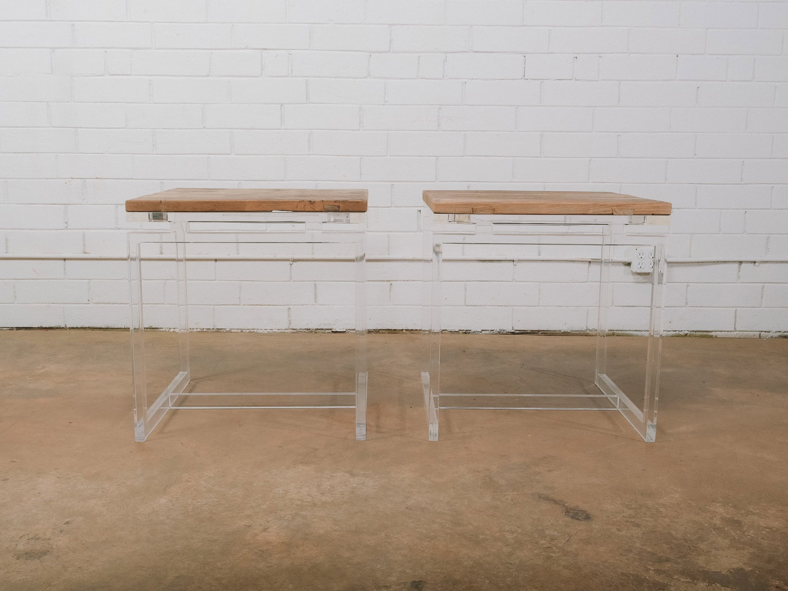 Pair of Wood and Acrylic Side Tables: Pair of contemporary side tables featuring thick wood tops supported by clear acrylic waterfall-style bases. The combination of natural wood and transparent acrylic creates a clean, modern aesthetic