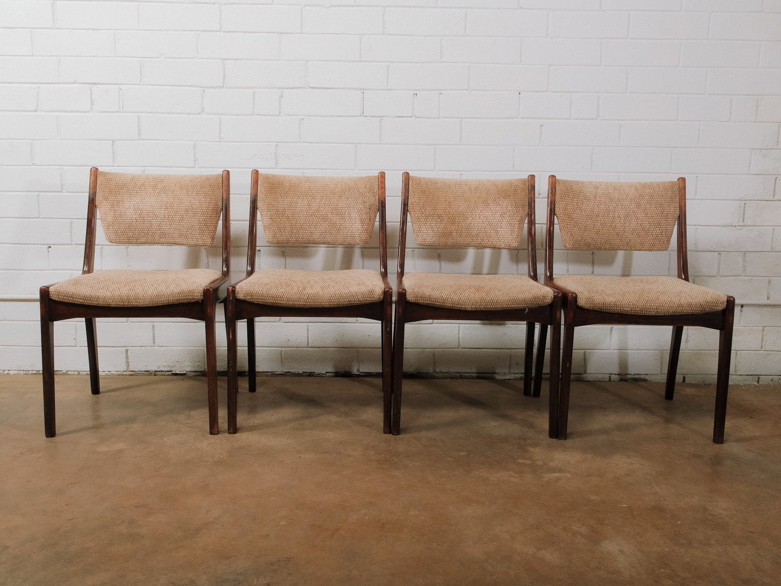 Set of 4 MCM Walnut Dining Chairs: Set of four mid-century modern walnut dining chairs featuring sculptural frames and newly upholstered textured fabric seats and backs. Their clean lines and comfortable design make them ideal for dini