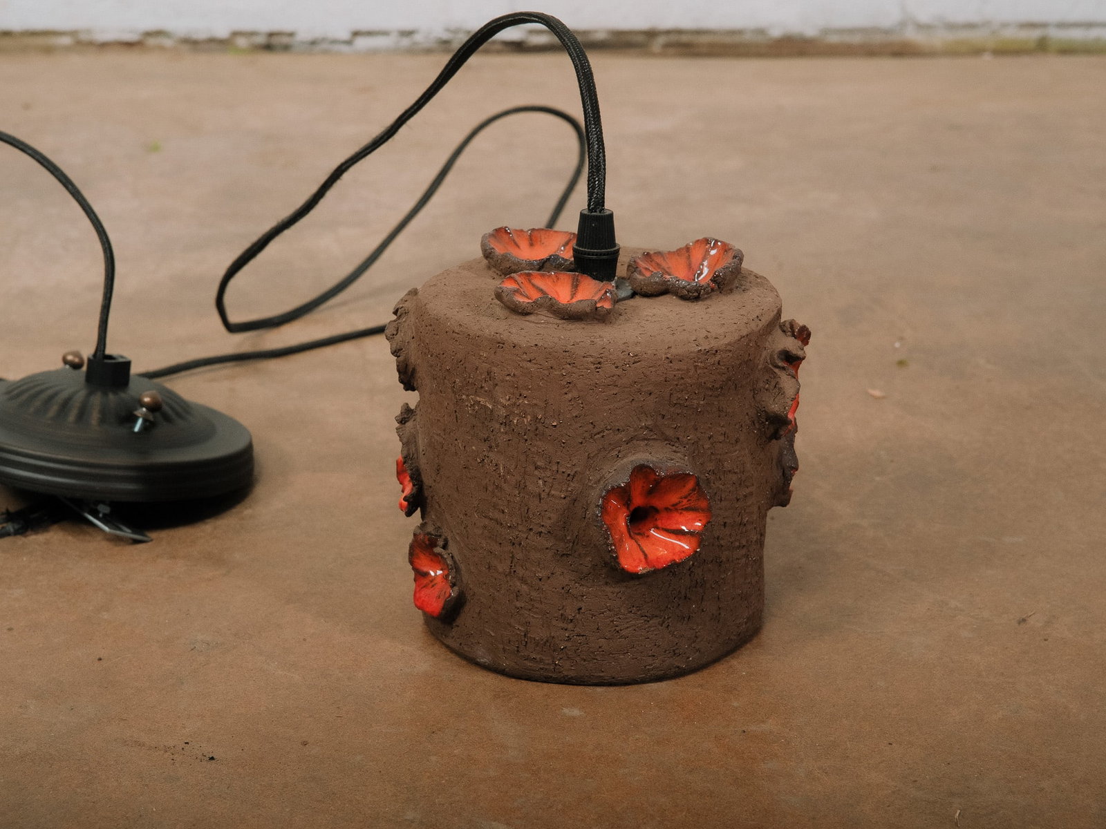 Brown & Red Pottery MCM Pendant Light: Vintage Brutalist-style studio pottery pendant light featuring a hand-thrown gourd-form ceramic shade with a heavily textured surface and pierced lower gallery that casts decorative patterns of