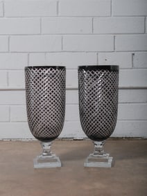 Pair of Tall Cut Crystal Pedestal Vases: Elegant pair of elongated cut crystal vases on stepped square bases. Intricate diamond lattice pattern and impressive scale make them striking mantel or console centerpieces.