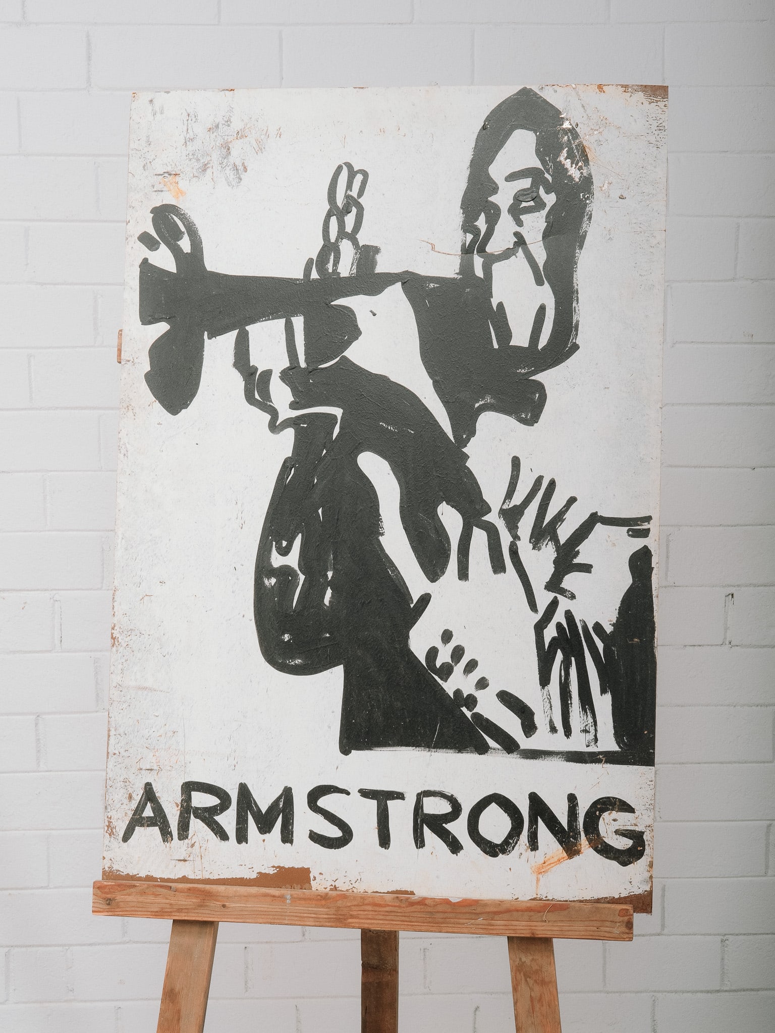 "Armstrong" Painting on Vintage Sheet Metal: Contemporary portrait painting depicting Louis Armstrong performing with trumpet in bold black and white brushwork with graphic lettering below. Hand painted on a vintage sheet metal panel,